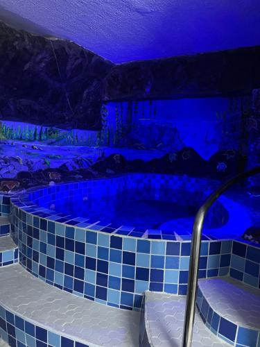 a hot tub with blue lights in a room at Sunrise-Nyali, Mombasa in Nyali