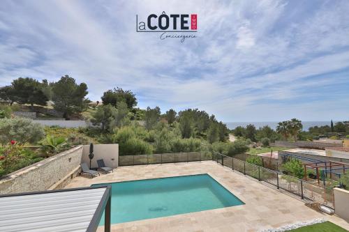 a swimming pool on top of a house at Villa Cheltane in Sausset-les-Pins
