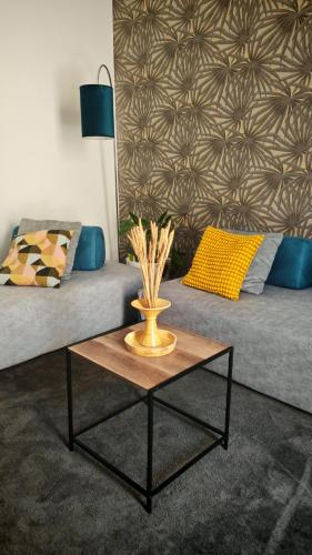 a coffee table in a living room with a couch at Isensi Luxury Suite Trani in Trani