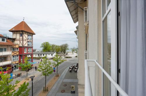 a view of a street from a balcony of a building at Hotel Aquamarin in Kühlungsborn