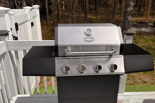 a gas grill sitting on top of a porch at Game Room and Fire Pit Poconos Family Getaway in Tobyhanna