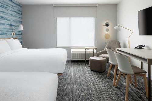 Una televisión o centro de entretenimiento en TownePlace Suites by Marriott Hadley Amherst
