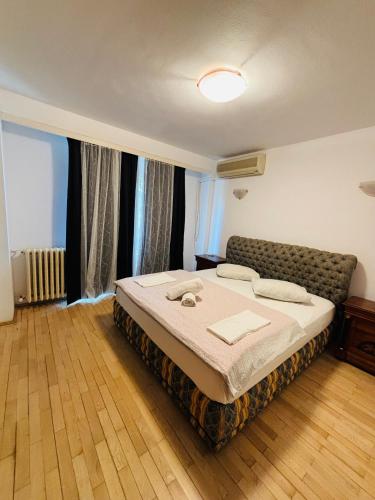 a bedroom with a bed in a room at Floreasca apartment in Bucharest
