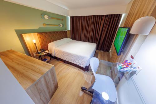 Postel nebo postele na pokoji v ubytování Hotel Village Confort