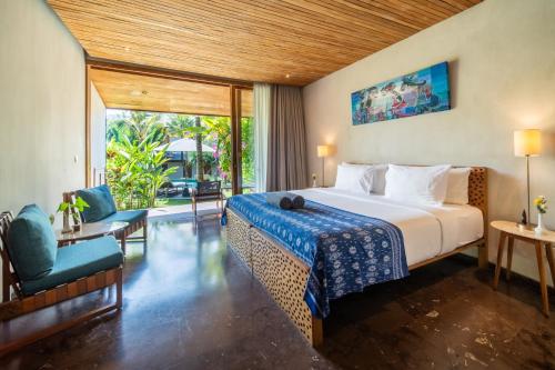 Postel nebo postele na pokoji v ubytování MASMARA Resort Canggu