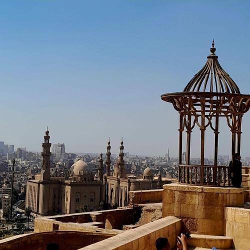 a view of a building with a gazebo at Akh Pyramid Hostel in Cairo