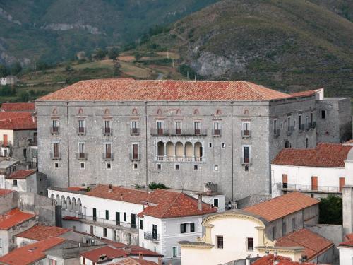 a large gray building with red roofs in a city at Montesanto 116 in Cosenza