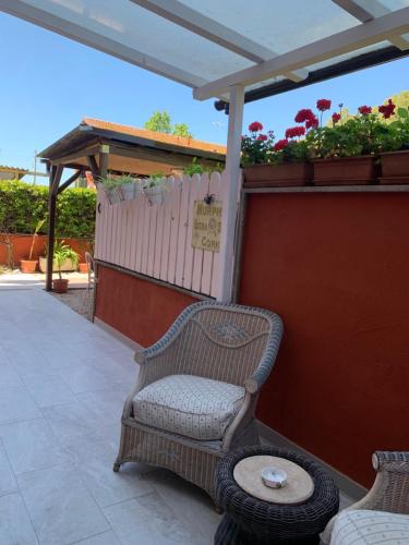 a chair and a table on a patio at La casa di Barbara in Le Cerquete