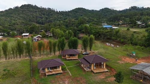 an aerial view of a village with cottages at zen mountain farmstay in Mae Wang