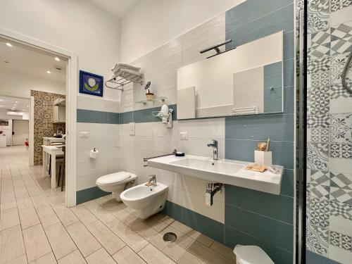 a bathroom with a sink and a toilet at lungomare rooms in Castellammare di Stabia