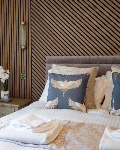 a bedroom with a bed with pillows on it at The Dragon in Willington