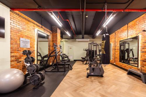 a gym with several treadmills and exercise equipment at Cape Town Lodge Hotel in Cape Town