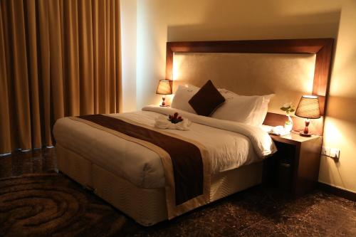 Cama o camas de una habitación en Belle Tower Apartments