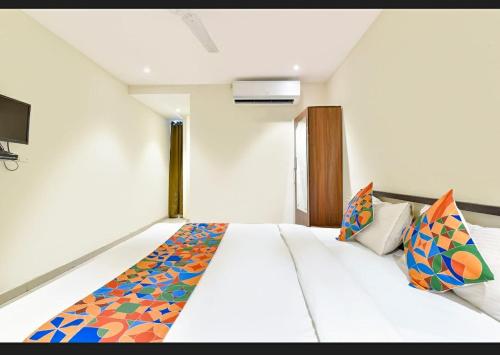 Katil atau katil-katil dalam bilik di Hotel Happy Rooms