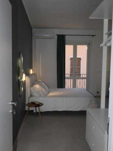 a bedroom with a large bed and a window at CASA di LU in Civitanova Marche