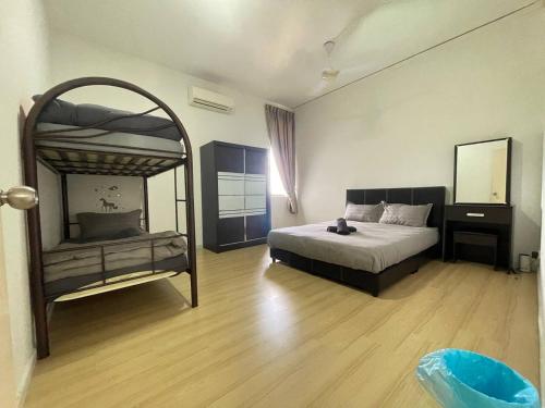 a bedroom with a bed and a large mirror at kkLee Homestay Condo Taiping A-4-6 in Taiping