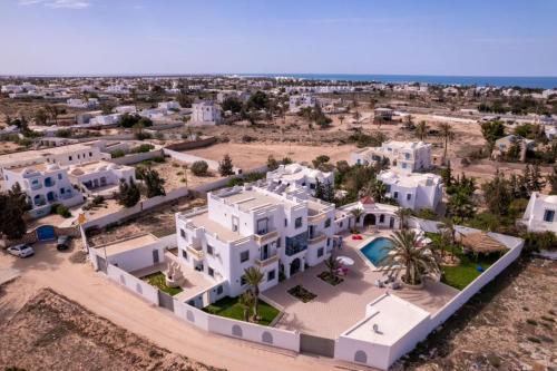 an aerial view of a villa in the desert at Dream Garden Djerba in Djerba