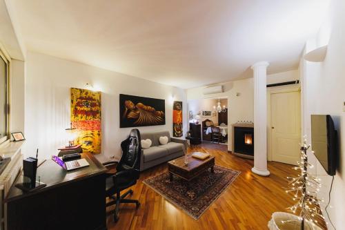 a living room with a couch and a table at Villa ElSi, Where Relaxation and Elegance Meet in Valenzano