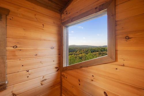 a window in a wooden room with a view at Majestic View in Mashburn Mill