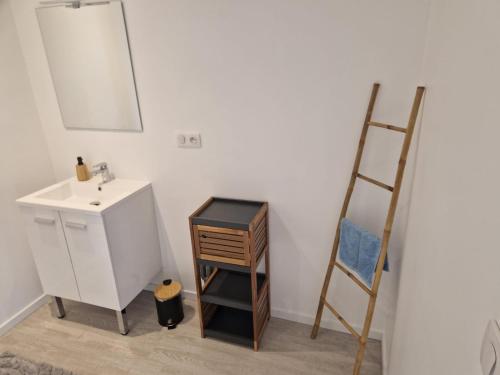 a bathroom with a sink and a ladder at Terre&Mer in Lamballe Armor