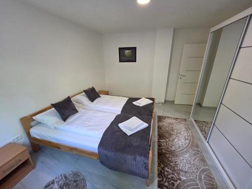 a bedroom with a large bed in a room at Sarajevo Pulse Residence in Sarajevo