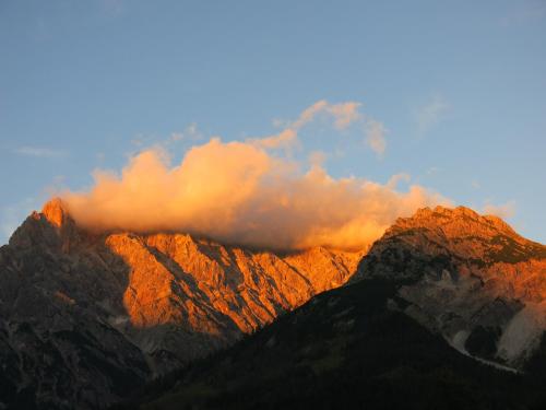 a view of a mountain with clouds in the background at Ferienwohnung Simonhof in Maria Alm am Steinernen Meer