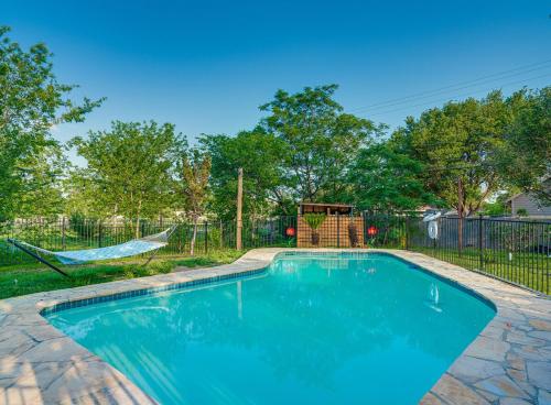 a swimming pool in a yard with a playground at Family fun 4bed 2bath with pool in San Antonio