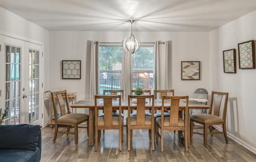 a dining room with a table and chairs at Family fun 4bed 2bath with pool in San Antonio