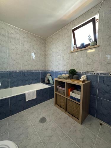 a bathroom with a bath tub and a sink at Estúdio Azul-T0-Torralta-Ocean View by Aura in Alvor