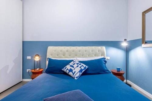 Postel nebo postele na pokoji v ubytování Blue Nest - Stazione Centrale