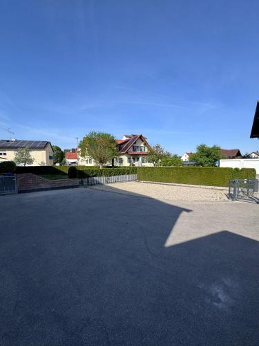 a large parking lot with houses in the background at Bavaria Home Rohrbach in Rohrbach