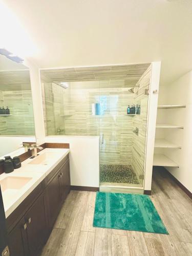a bathroom with a shower with a glass door at Mary s house in Fairbanks