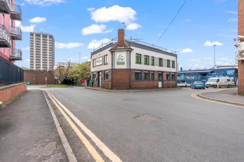 a building sitting on the side of a street at Contemporary Comfort Steps from Ricoh Are… - 17179 in Coventry