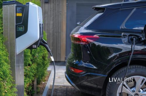 a car is plugged into a solar electric car charger at LIVALPIN ToGether in Garmisch-Partenkirchen