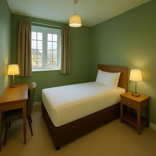 a bedroom with a bed and two tables and a window at Moorhill House Hotel in Burley