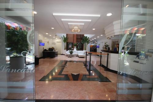 a lobby of a store with a glass wall at Lancaster House in Bogotá