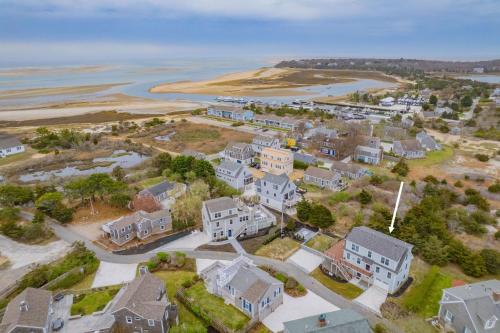 an aerial view of a residential neighborhood next to the water at 37 Clam Shell Drive Chatham - Slow M'Ocean in Chatham