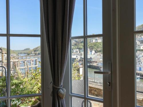 a window with a view of a city at Albany in Looe