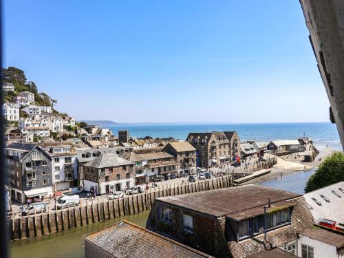 a view of a town with the ocean in the background at Albany in Looe