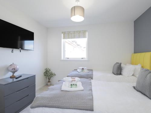 Una cama o camas en una habitación de Flat 10