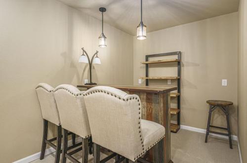 a dining room with chairs and a wooden table at Ranch Retreat W Hot Tub & Patio in Cheyenne