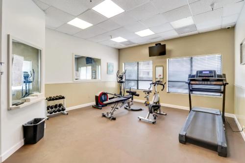 a gym with treadmills and ellipticals in a room at Coastal Retreat Villa on Port Royal Sound in Hilton Head Island