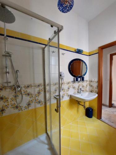 a bathroom with a shower and a sink in it at palazzo sardanelli camera in Pizzo