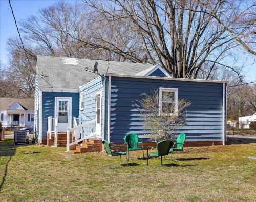 a blue house with chairs in front of it at Private House Mins to Maymont Park, Trails & VCU! in Richmond