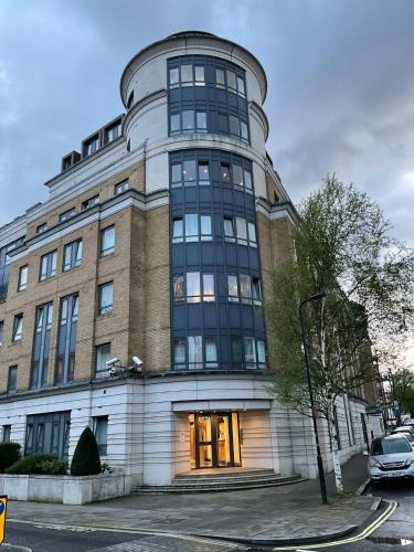 a large building with a large window at 2 Bedroom Apartment with security 24 hours in London