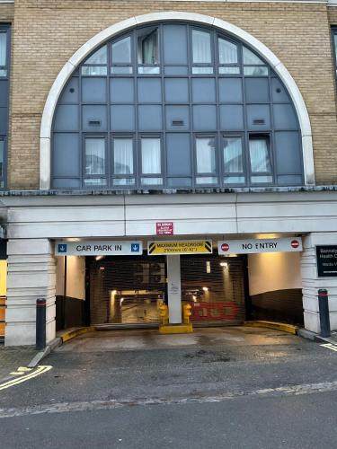 a building with a car park in front of it at 2 Bedroom Apartment with security 24 hours in London