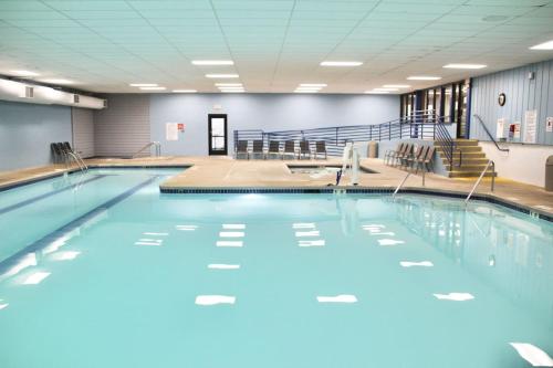 a large swimming pool with blue water in a gym at Dells Vacations At Tamarack Resort in Wisconsin Dells