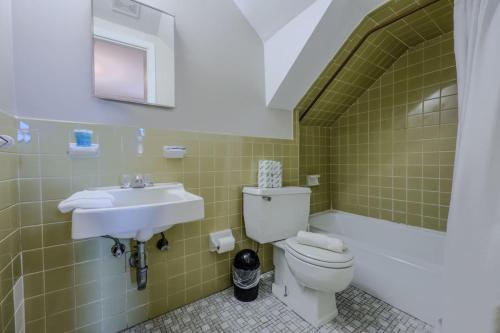 a bathroom with a toilet and a sink at Modern South End Studio Apt in Boston