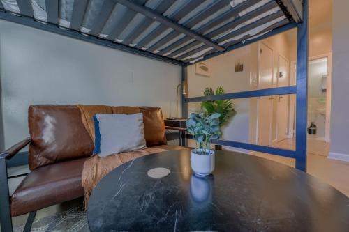 a living room with a table and a couch at Cozy Studio South End in Boston