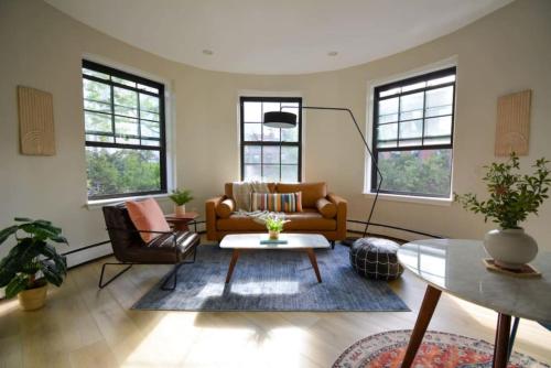 a living room with a couch and a table at Comfy Back Bay Alcove Studio Apt in Boston